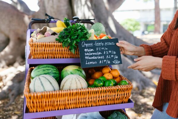 Vibrant display of organic fruits and vegetables at a farmers market.